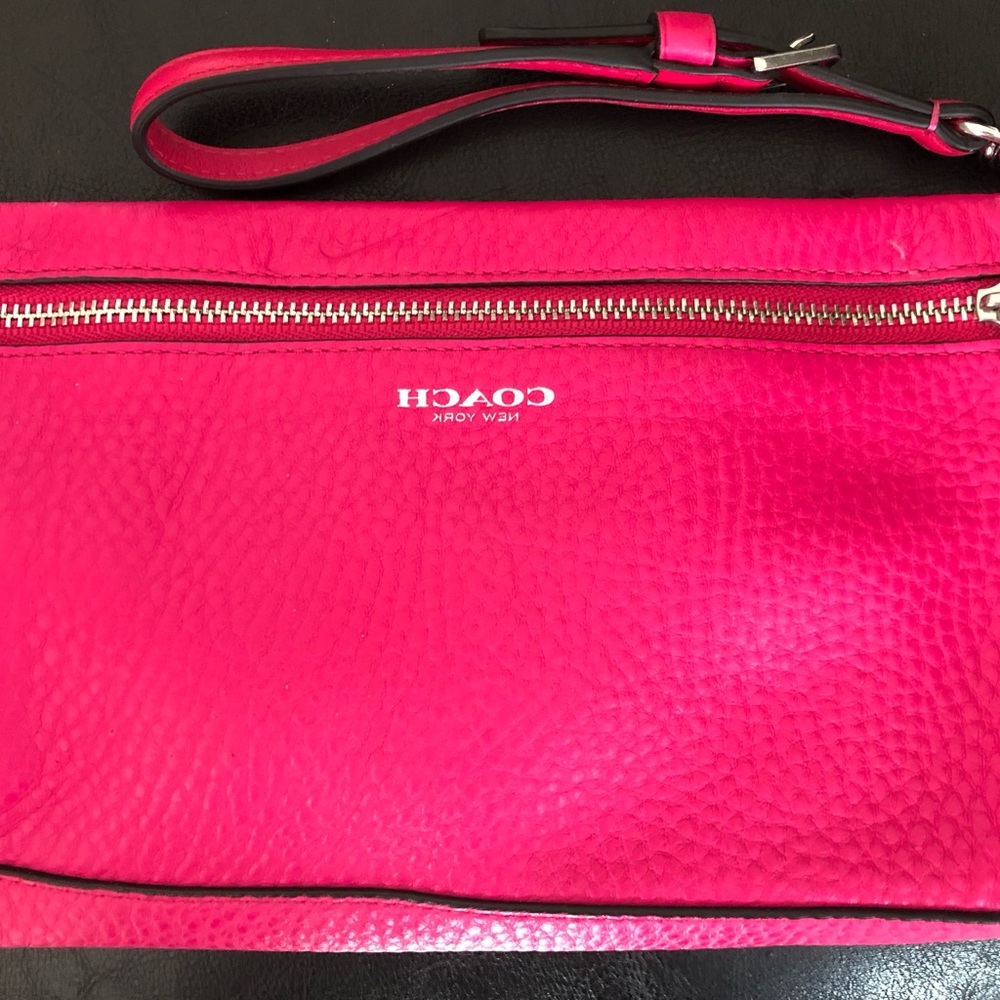 Large Coach wristlet, perfect accent for a summer outing.